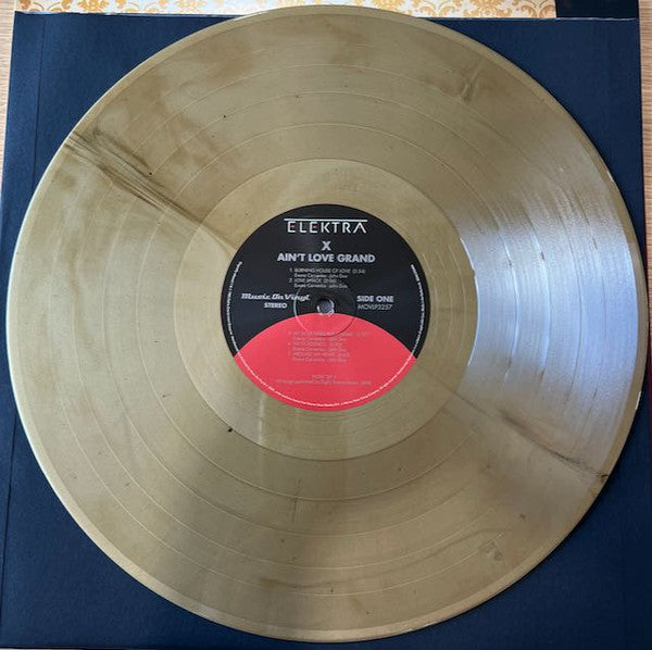 X (5) : Ain't Love Grand (LP, Album, RE, Gol)