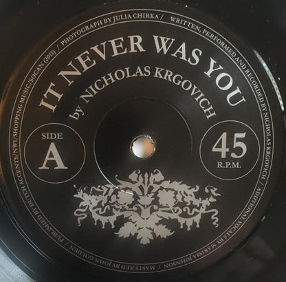 Nicholas Krgovich* : It Never Was You (7", Single)